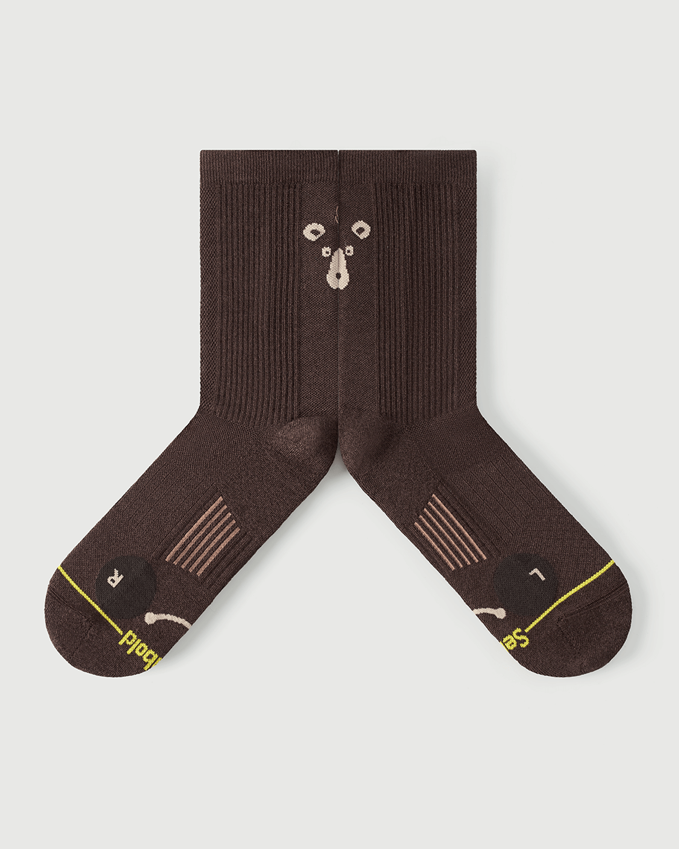 Detail shot of Humble Bear brown socks focusing on the inner arch spine and medical-grade support.