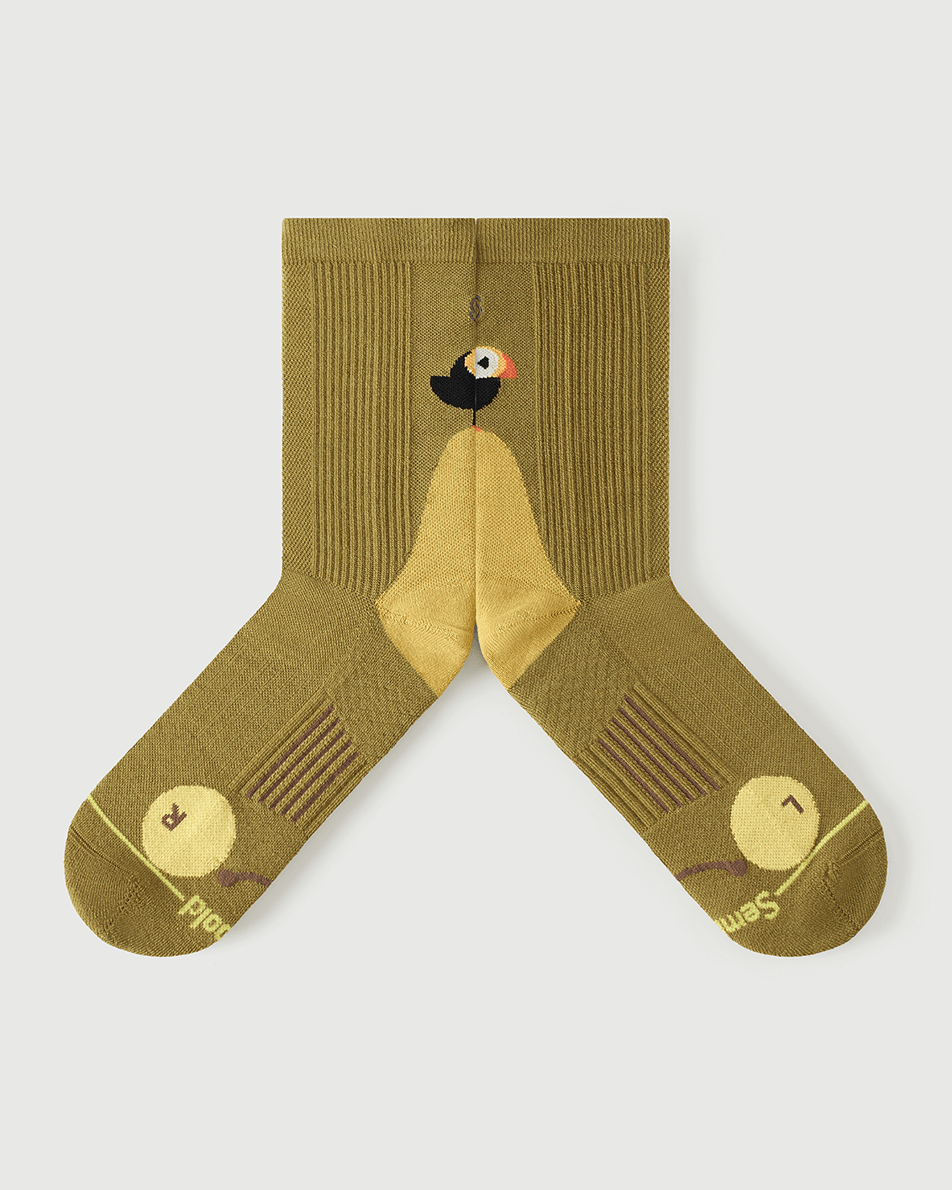 Detailed flat lay of Royal Puffin yellow socks highlighting the inner arch spine for extra stability.