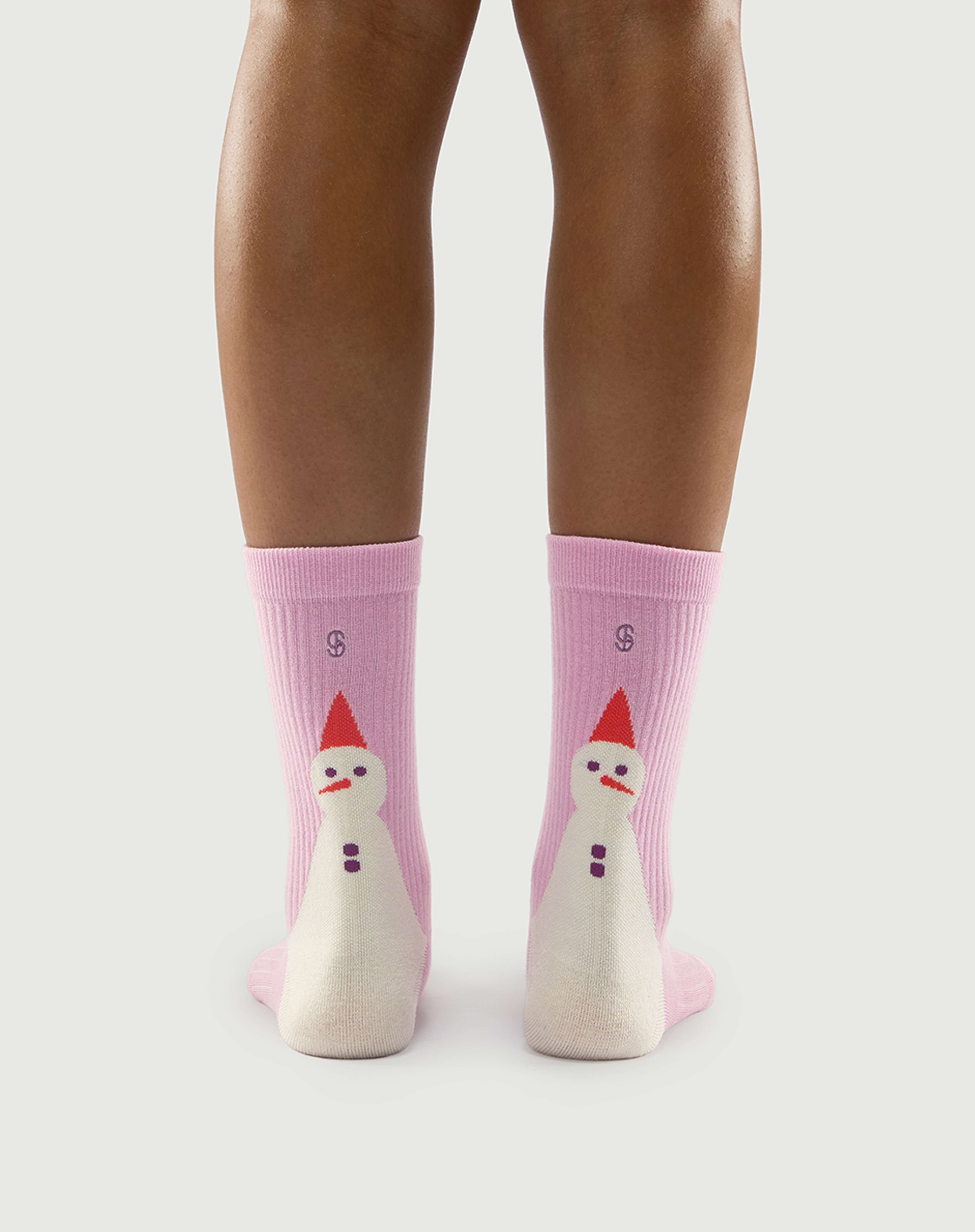 Back view of pink Sakura Snowman socks on a model, highlighting the cute snowman pattern.