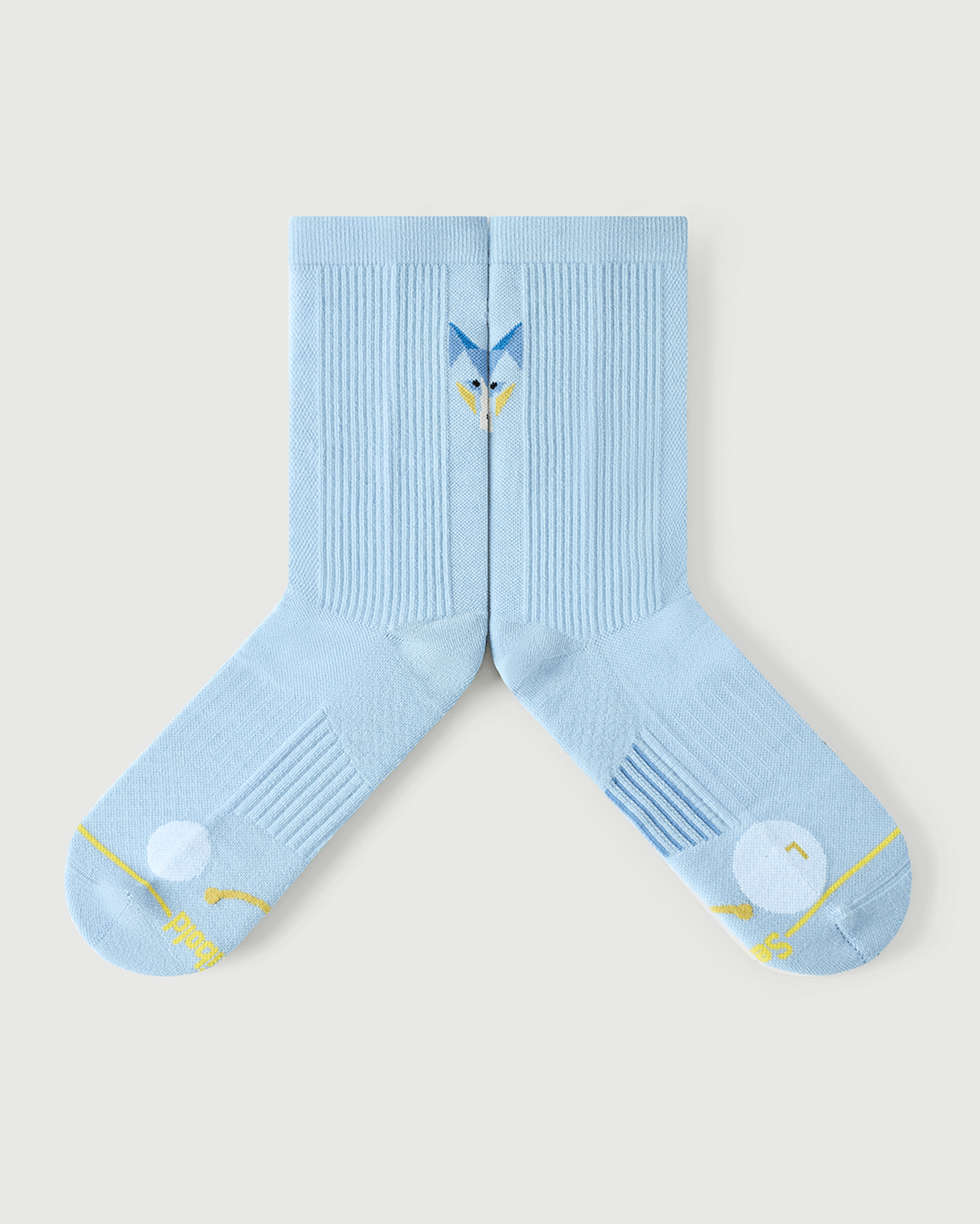 Flat lay view of light blue Silent Wolf socks focusing on the inner medial arch support construction.