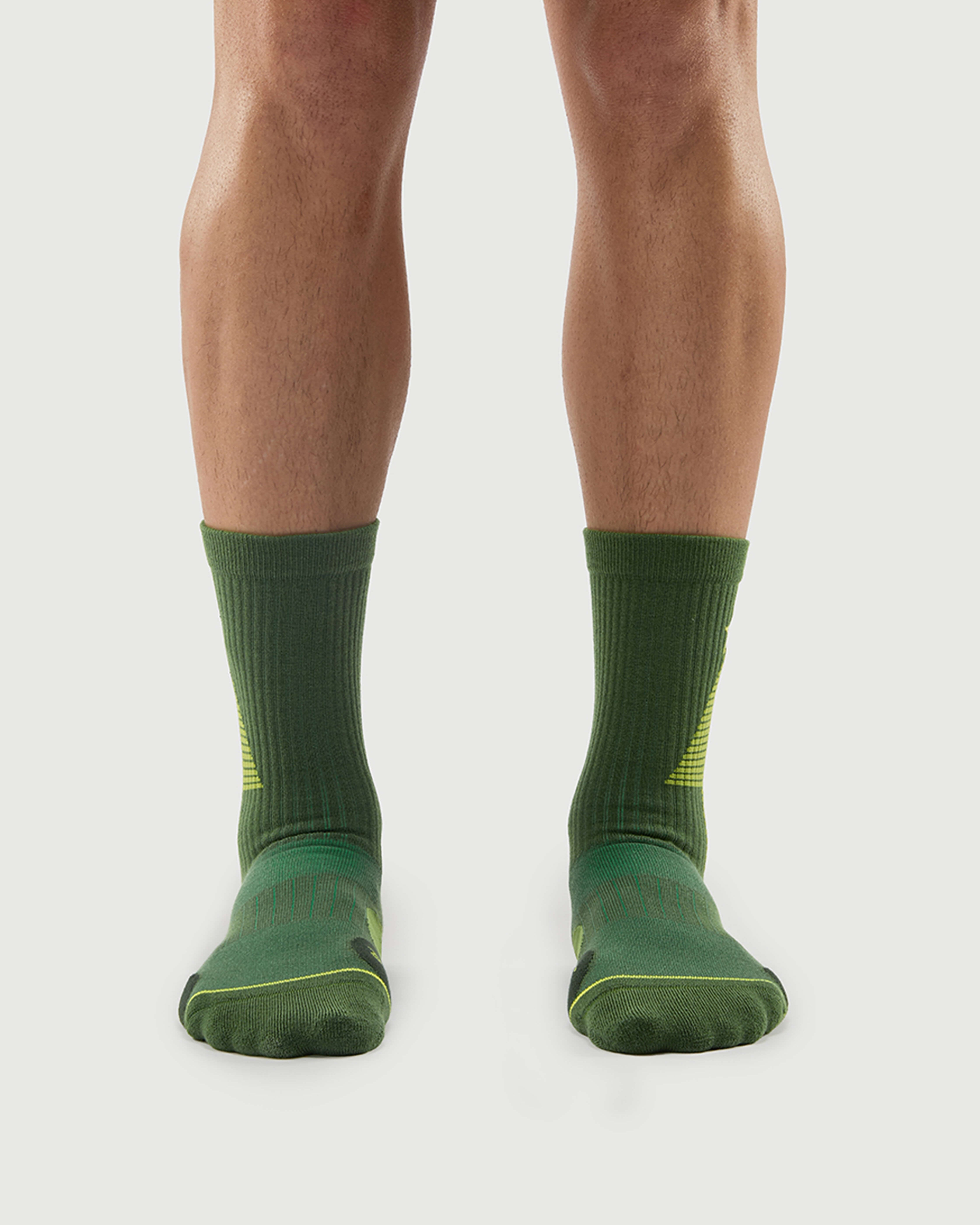 Front view of a model wearing Starry Pine Merino wool hiking crew socks, showcasing the secure ribbed fit and high-performance knit.