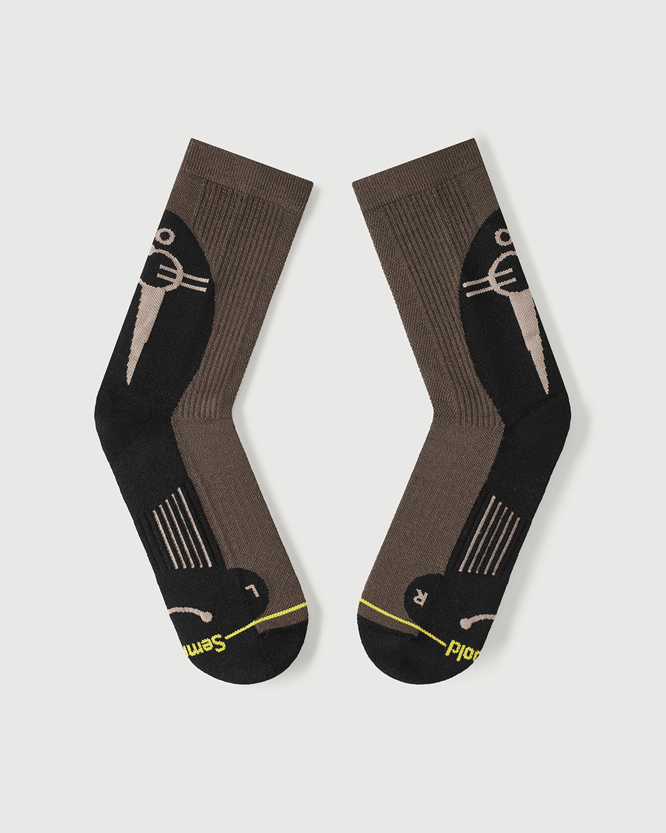 Flat lay view of Whiz Walrus socks focusing on the inner arch spine for maximum stability.