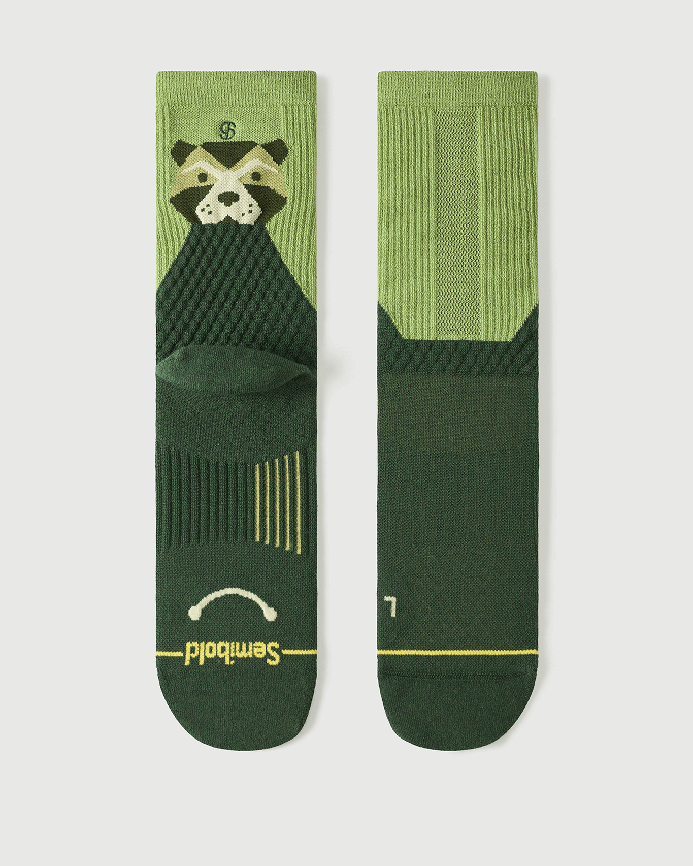 Flat lay of Semibold Crafty Otter green Merino socks, showing the two-tone green design.