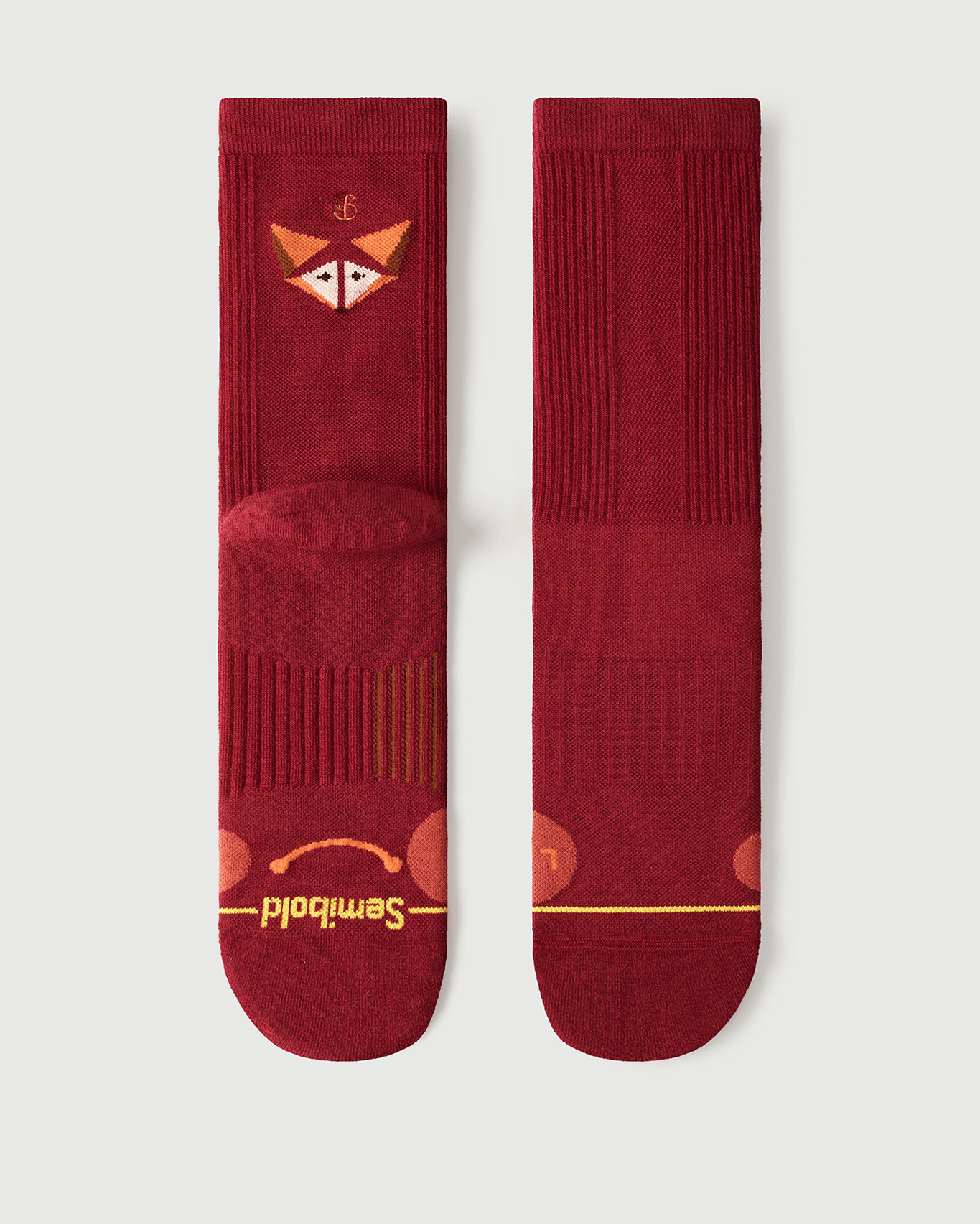 Flat lay of Semibold Devoted Fox red Merino wool socks showing front and back views.