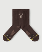 Detail shot of Humble Bear brown socks focusing on the inner arch spine and medical-grade support.