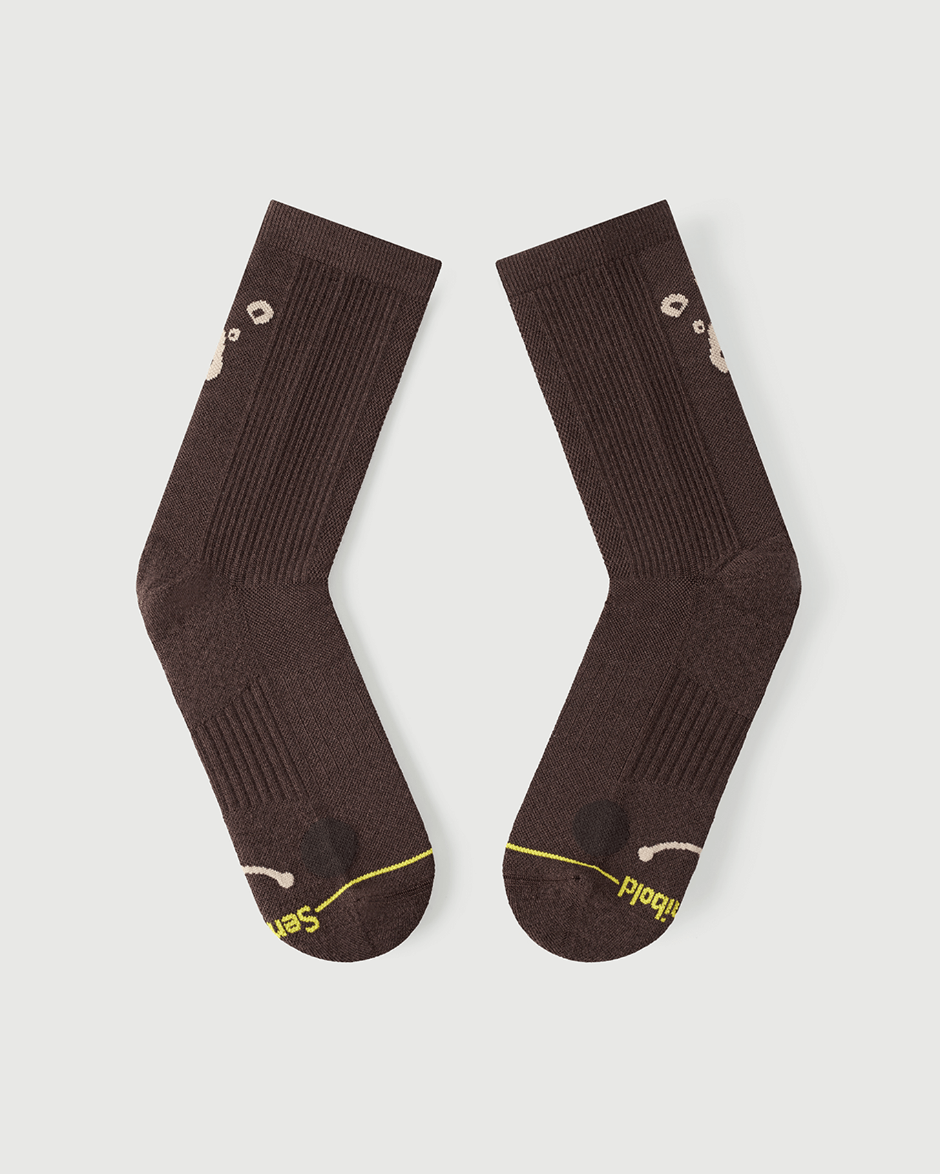 Flat lay view of the lateral side of brown Humble Bear Merino wool socks.