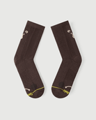 Flat lay view of the lateral side of brown Humble Bear Merino wool socks.