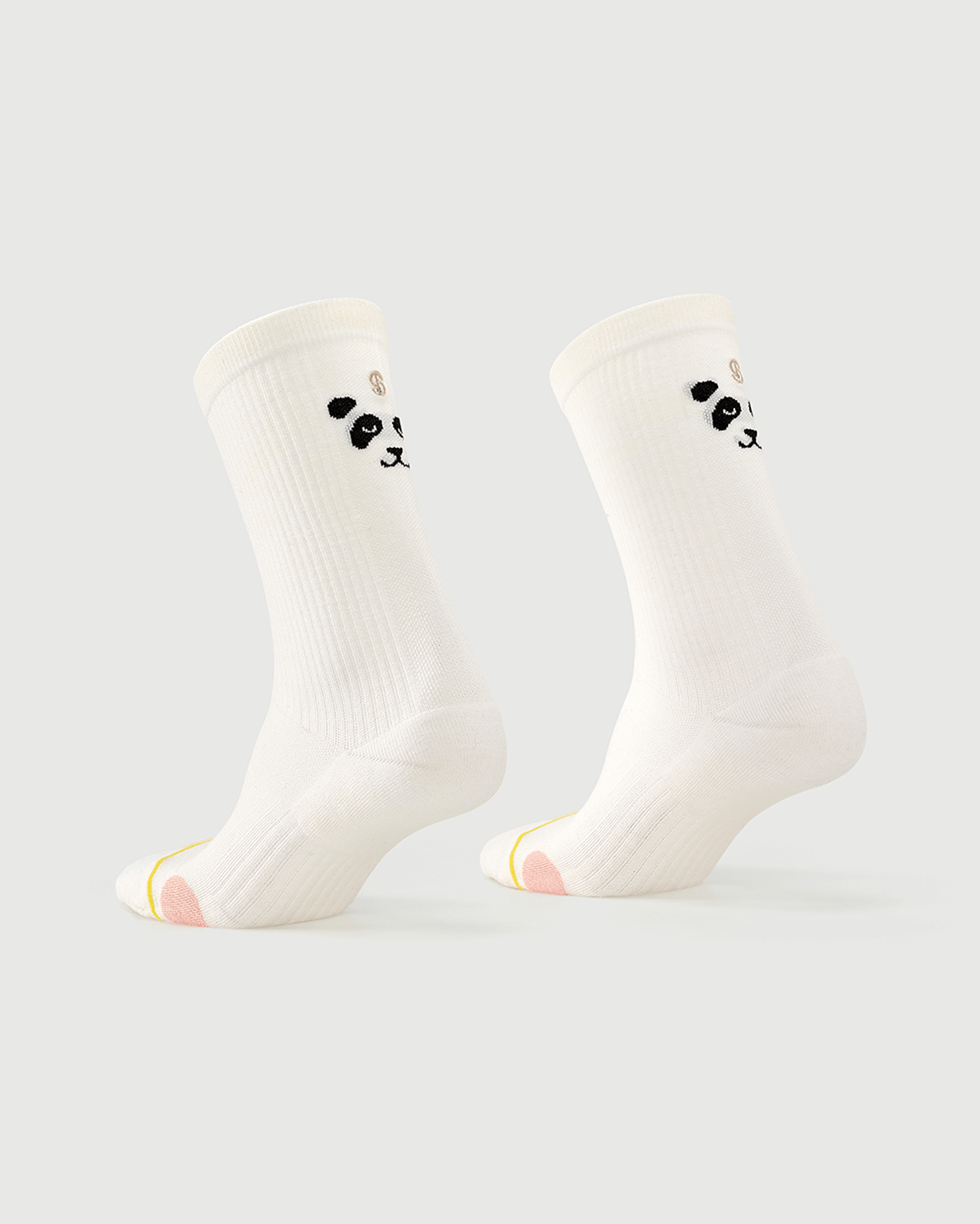 White Naughty Panda socks on a foot form, showing the playful panda character on the heel.