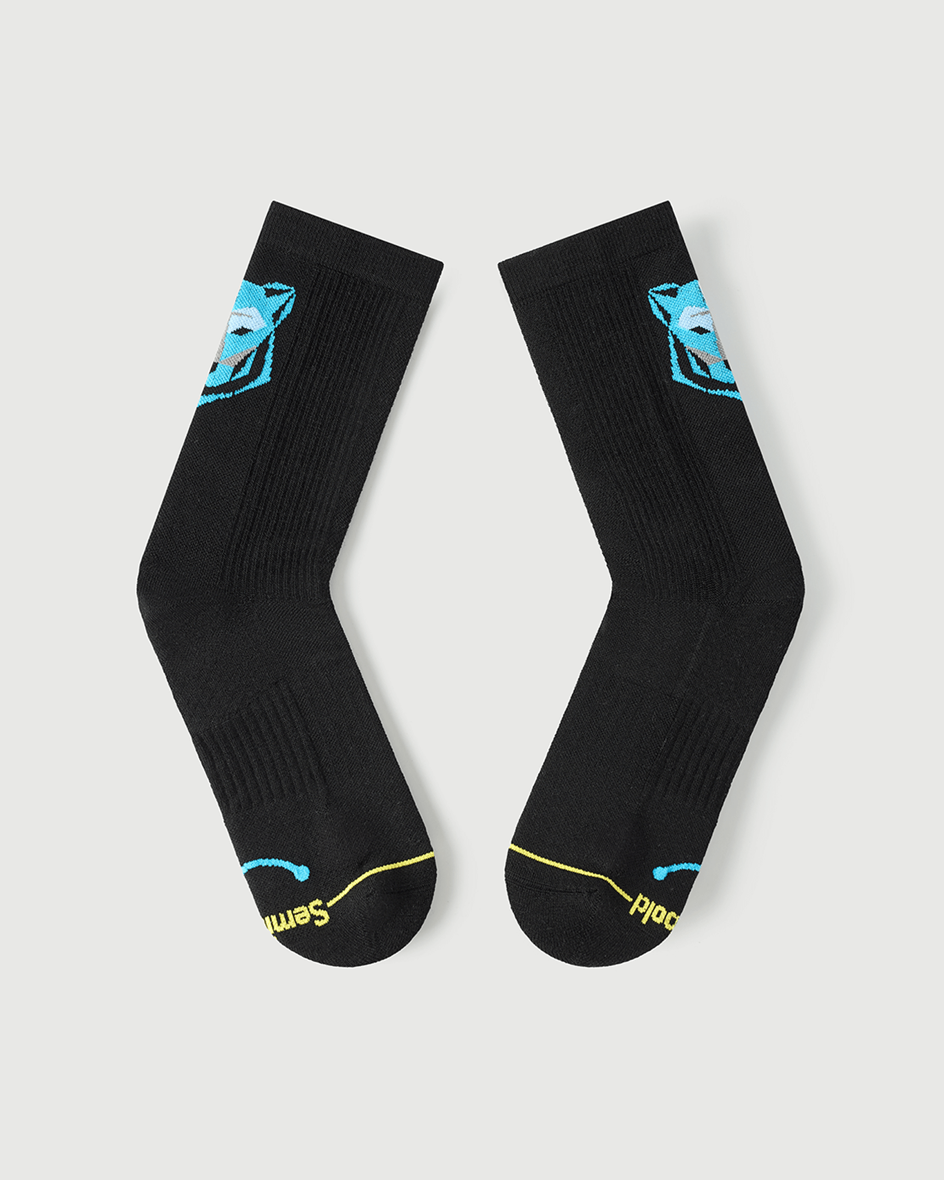 Flat lay view of the lateral side of Regal Tiger black Merino wool performance socks.