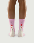 Back view of pink Sakura Snowman socks on a model, highlighting the cute snowman pattern.