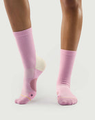 Side profile of pink Sakura Snowman socks on a model, perfect for everyday or hiking wear.