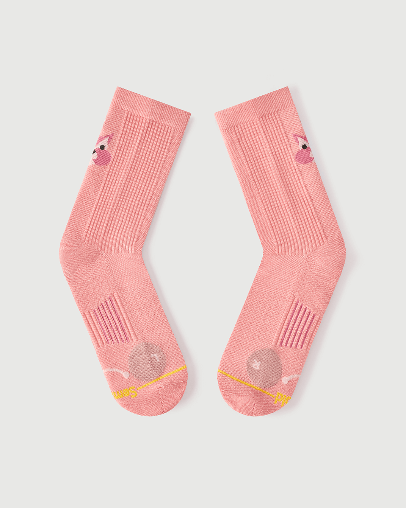 Flat lay of the lateral side of peach Savoring Squirrel socks, focusing on the toe cushioning.