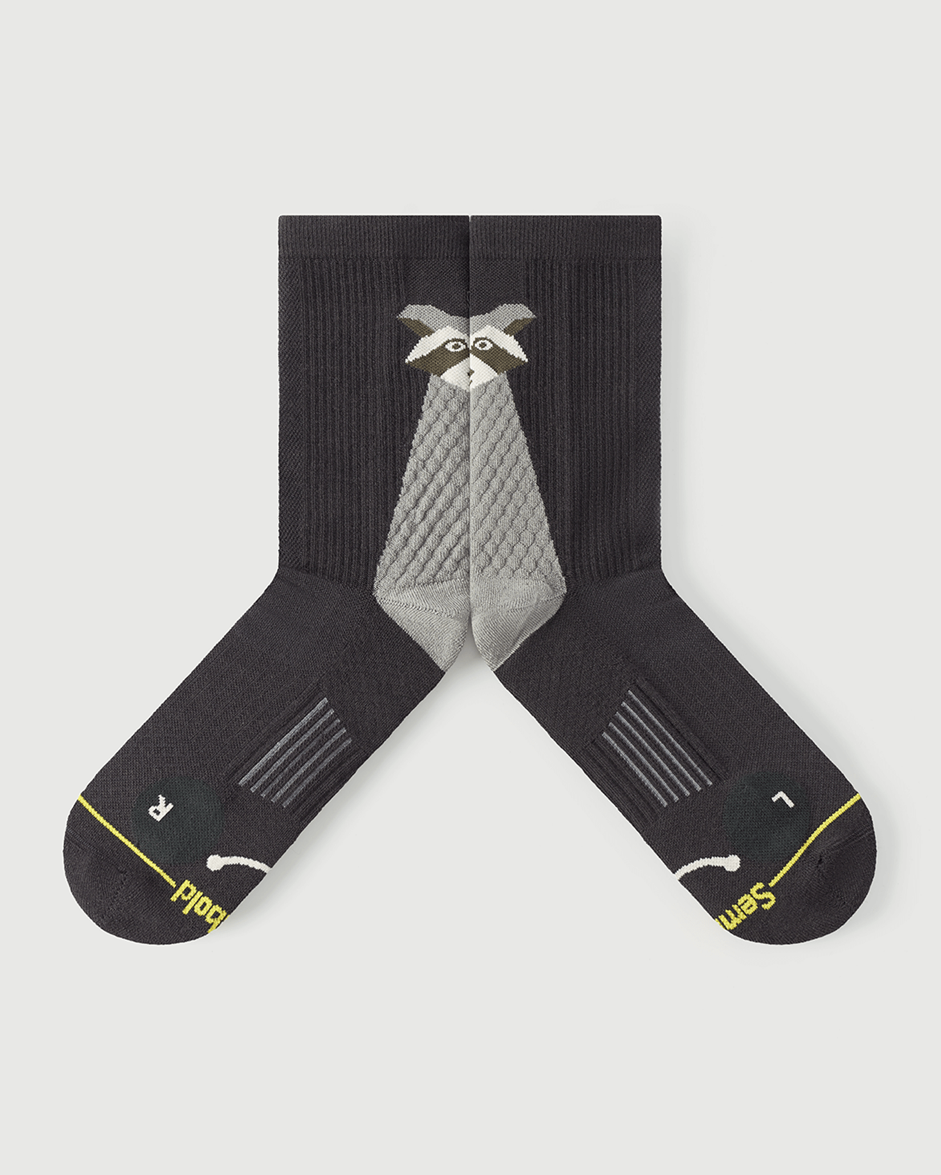 Detailed flat lay of Scrubby Raccoon socks focusing on the inner medial arch support zones.