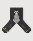 Detailed flat lay of Scrubby Raccoon socks focusing on the inner medial arch support zones.