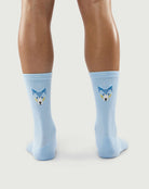 Model wearing light blue Silent Wolf socks, showcasing the wolf face pattern on the back.