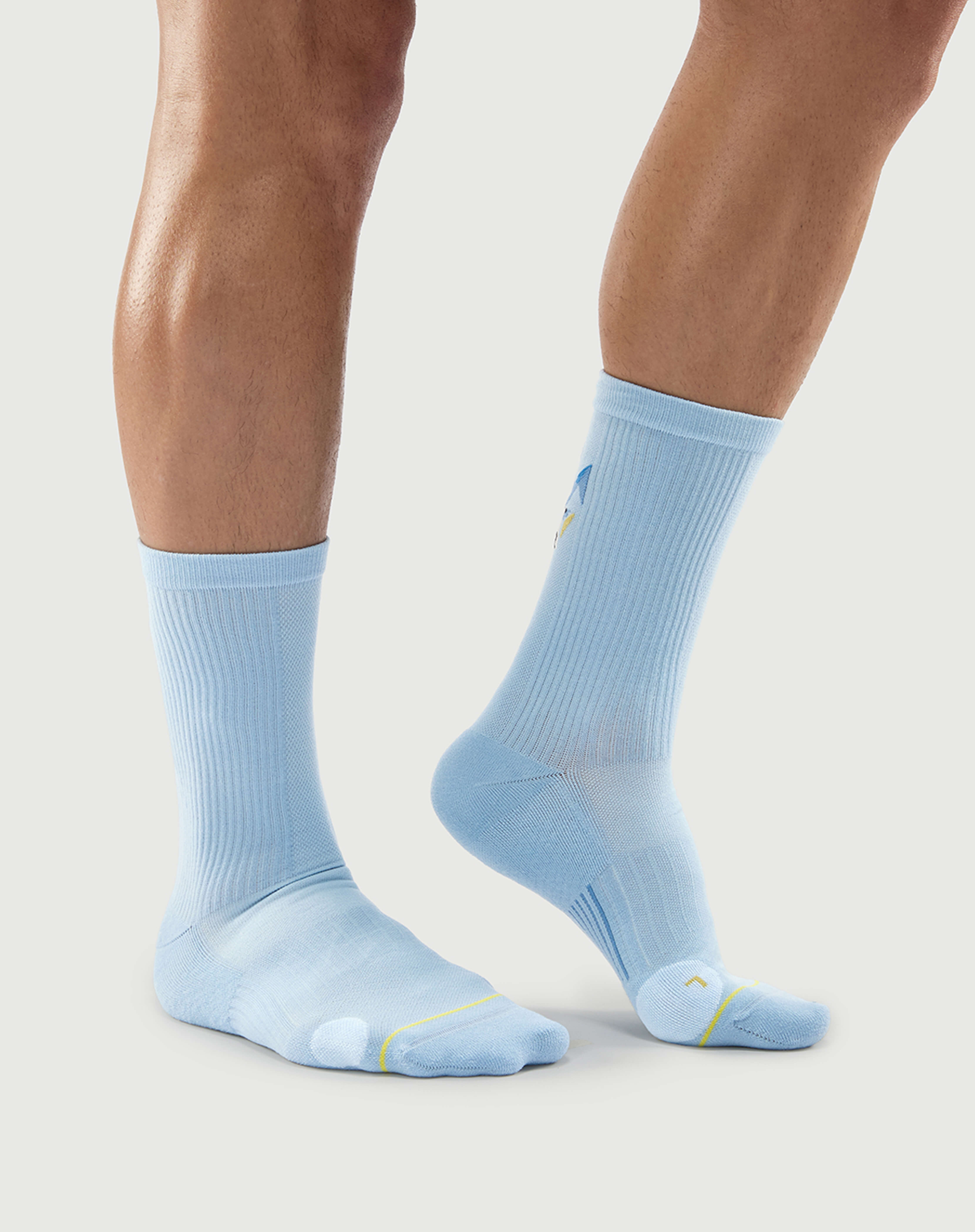 Side view of brown Semibold Silent Wolf hiking socks on a model highlighting the sleek profile.