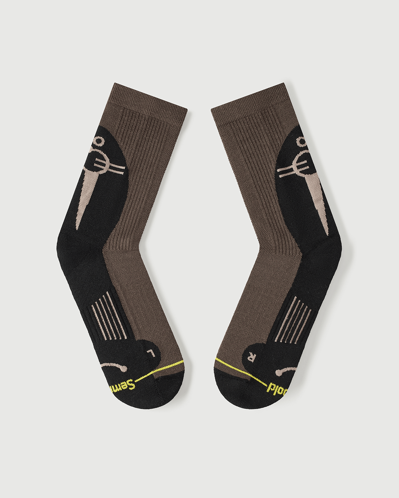 Flat lay view of Whiz Walrus socks focusing on the inner arch spine for maximum stability.