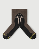 Flat lay view of the lateral side of Whiz Walrus black and brown Merino wool socks.